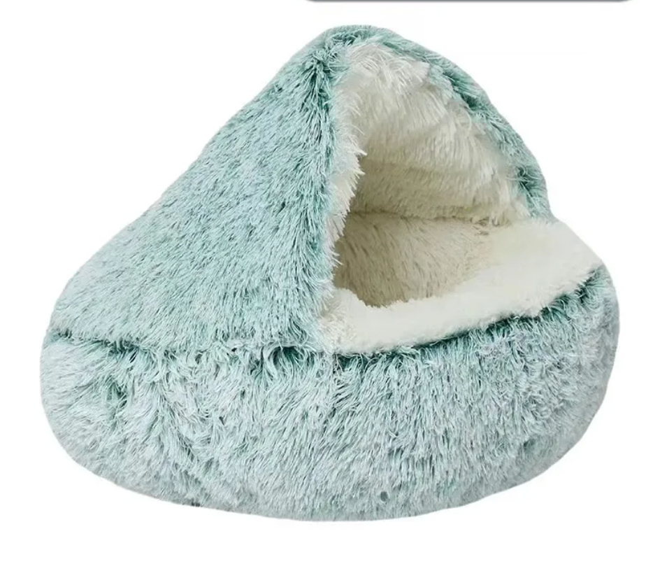 Teal semi-closed plush cat bed with soft inner lining and rounded nest shape