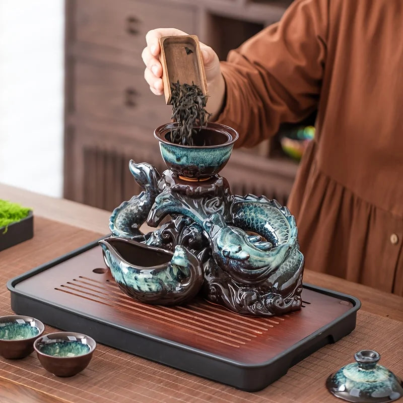 Ceramic dragon teapot set with rotating spout, teal glaze, dragon handles, tray and cups