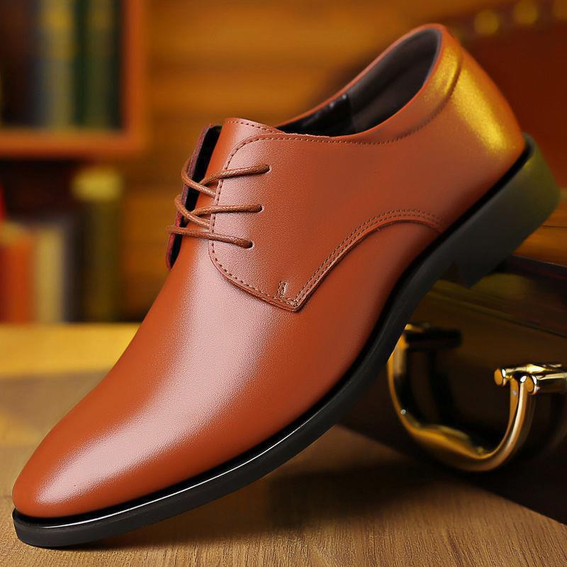 Men's brown leather lace-up oxford dress shoes with stitched V-panel detail.