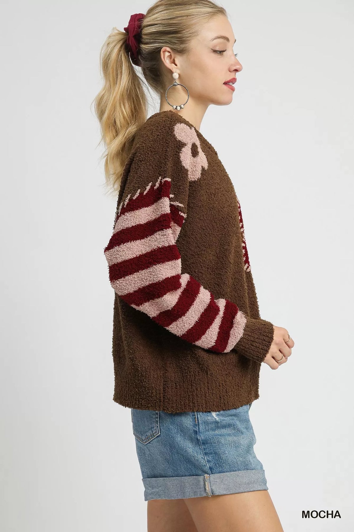 Mocha brown long-sleeve sweater with striped sleeves and side flower motif