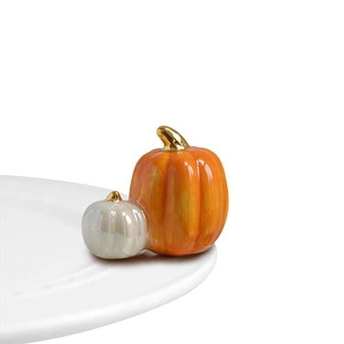Nora Fleming mini pumpkin spice topper: orange pumpkin and white pumpkin on white plate
