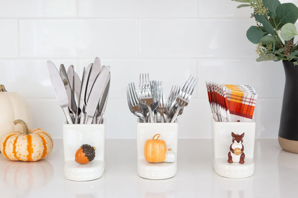 Nora Fleming mini pumpkin spice topper in utensil holder: orange and white pumpkins