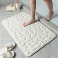 White bathroom bath mat with raised pebble-texture dots, flat anti-slip base