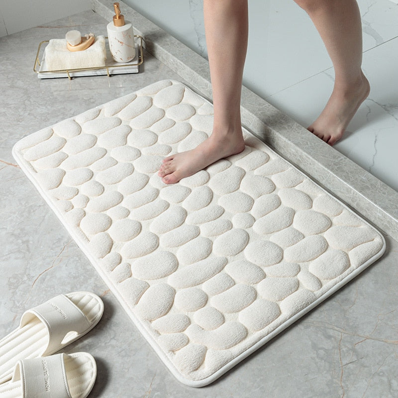 White bathroom bath mat with raised pebble-texture dots, flat anti-slip base