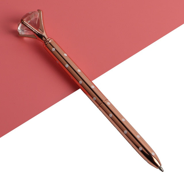 Brown gem-top metal ballpoint pen with faceted cap and dotted pattern barrel