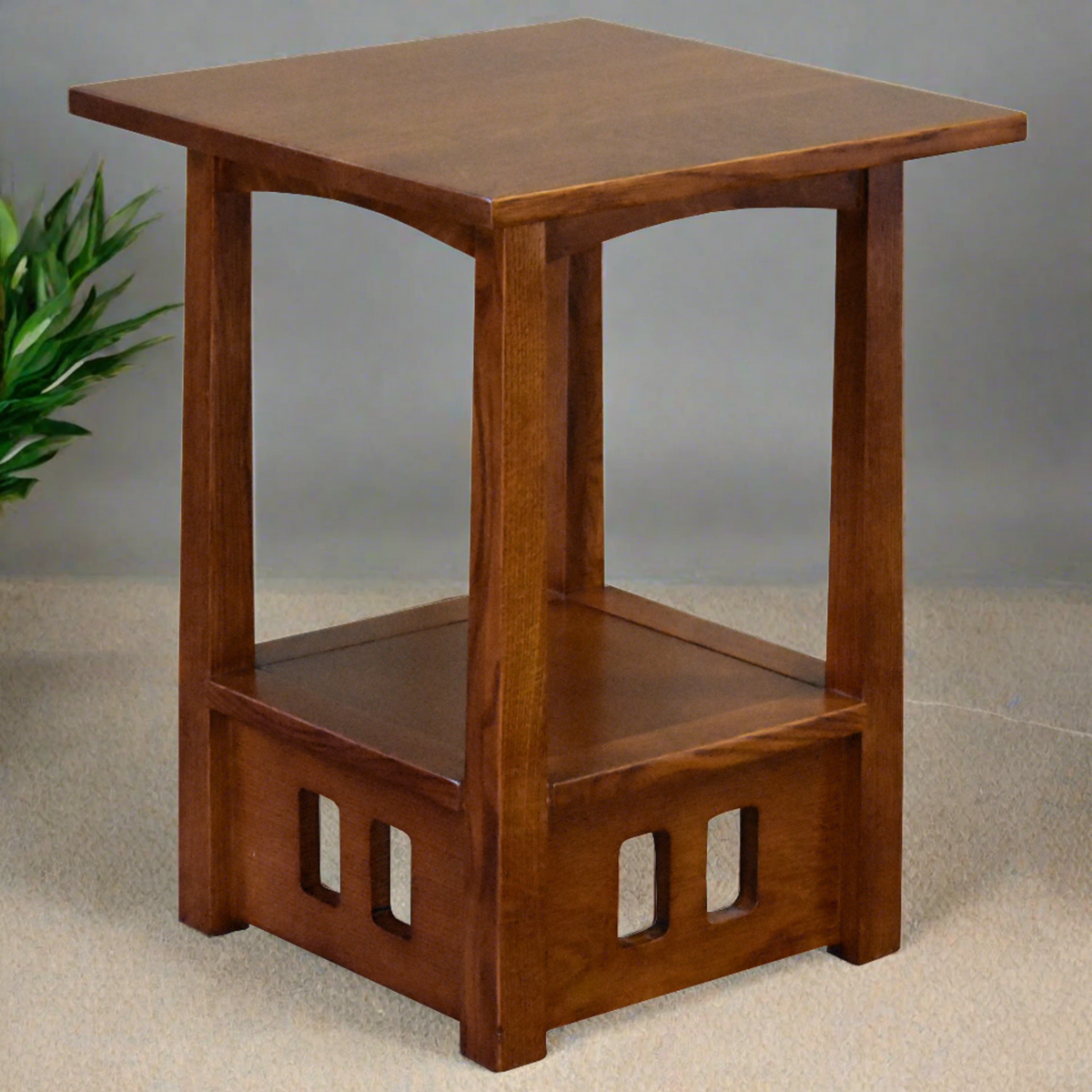 Walnut-style wood taboret end table with square top, lower shelf, and side cutouts.