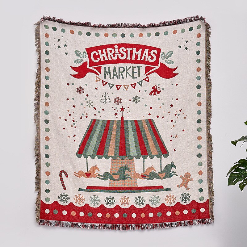 White towel blanket with “Christmas Market” sign, striped tent illustration, fringed border