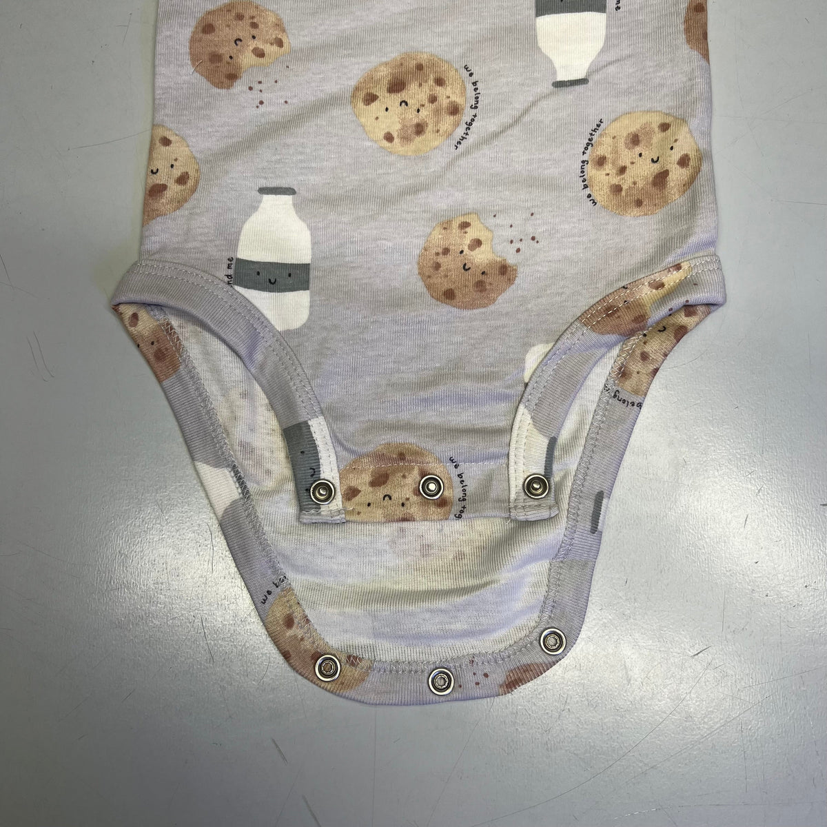 Baby cotton cookie-print bodysuit with snap front and bottom buttons