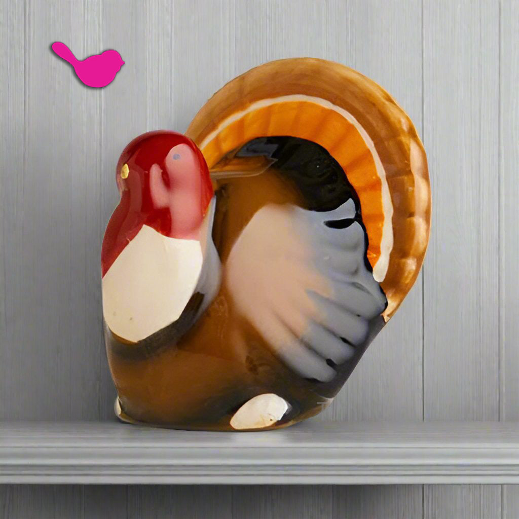 Mini ceramic turkey serving topper with open belly cutout, brown and red details