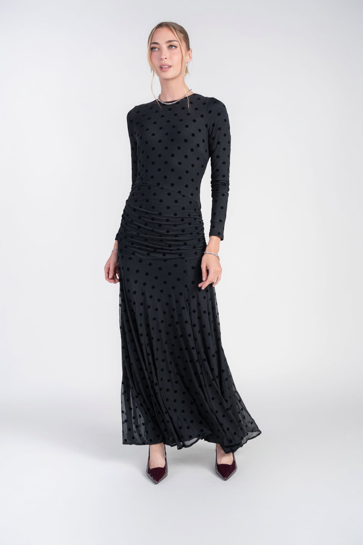 Black mesh dot maxi dress with long sleeves and ruched skirt, front view