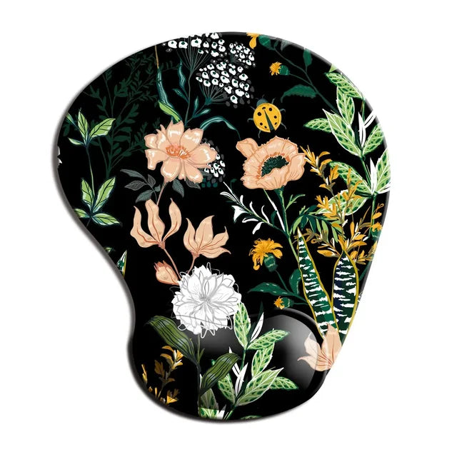 Ergonomic mouse pad wrist rest with dark floral jungle print and curved wrist support