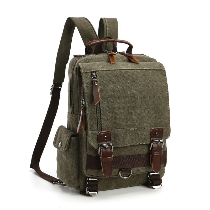 Olive green canvas backpack with top handle, front flap pocket, and adjustable shoulder strap