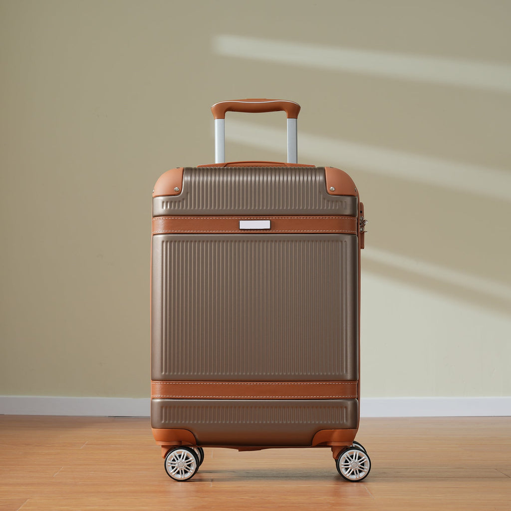 Grey carry-on suitcase with telescoping handle and copper-brown trim, upright view