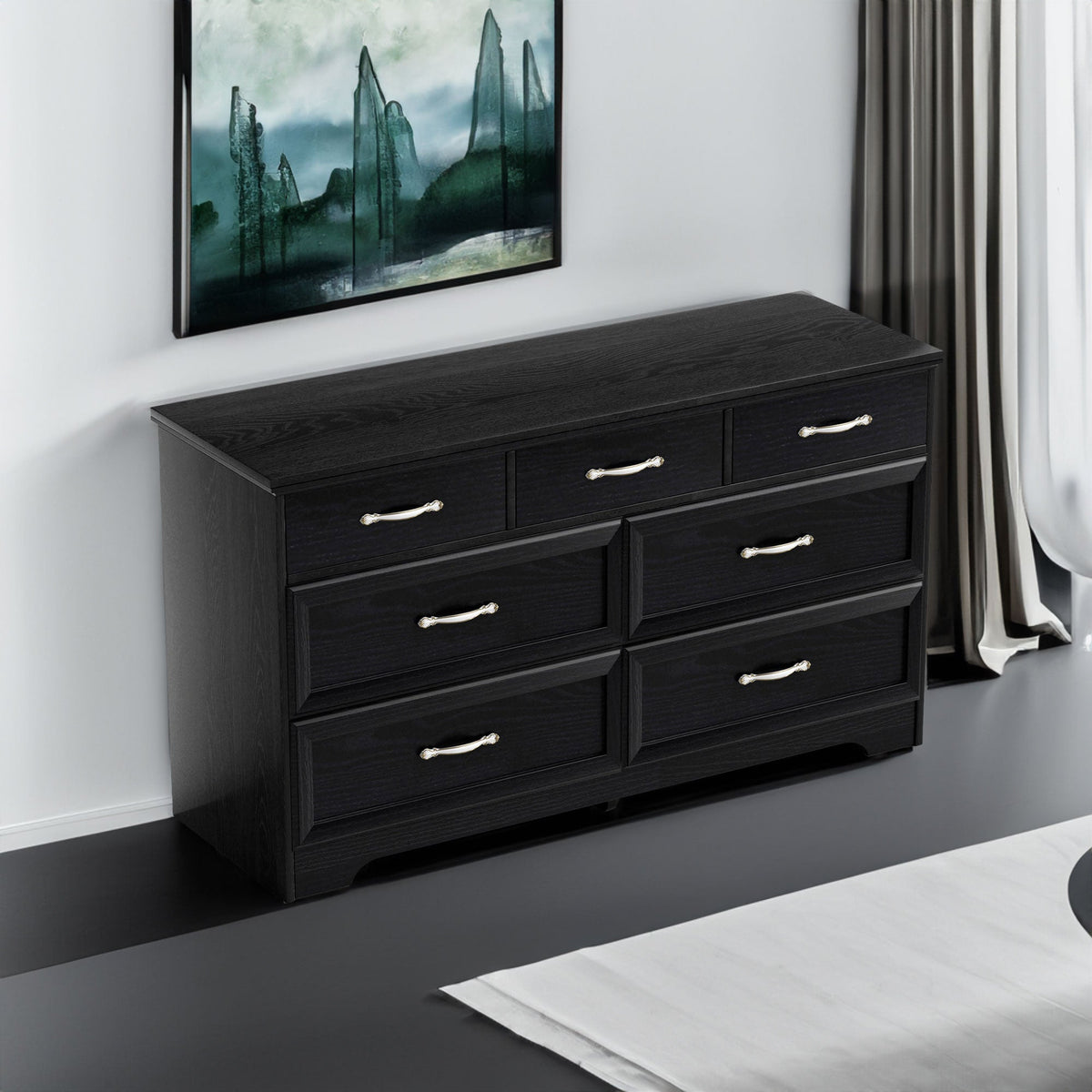 Black chest of drawers with metal pull handles, multi-drawer front