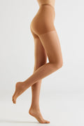 Nude 20 den shaping tights on model, full-leg side view with smooth finish.