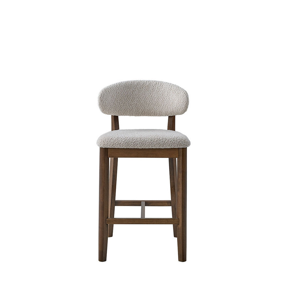 Light gray upholstered counter bar stool with round backrest and cross-brace wood base