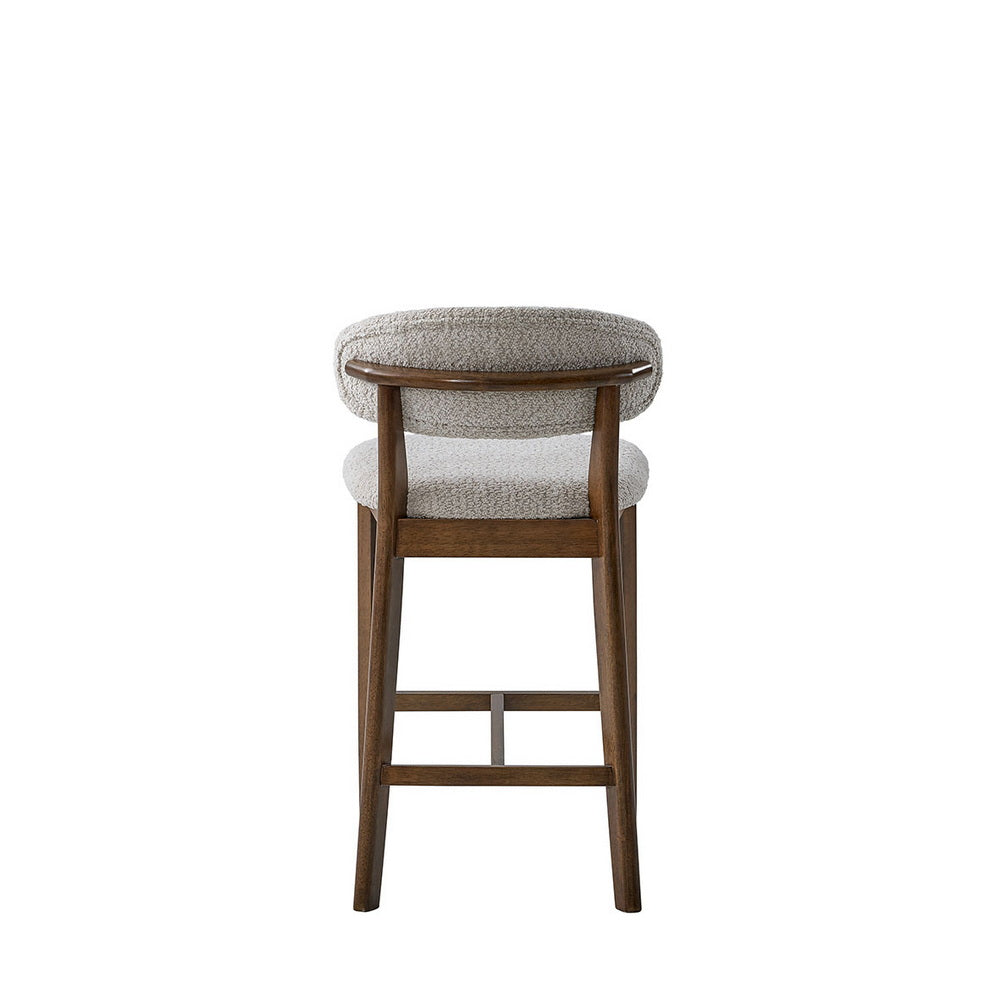 Light gray upholstered bar stool with rounded seat, curved back, and dark wood frame