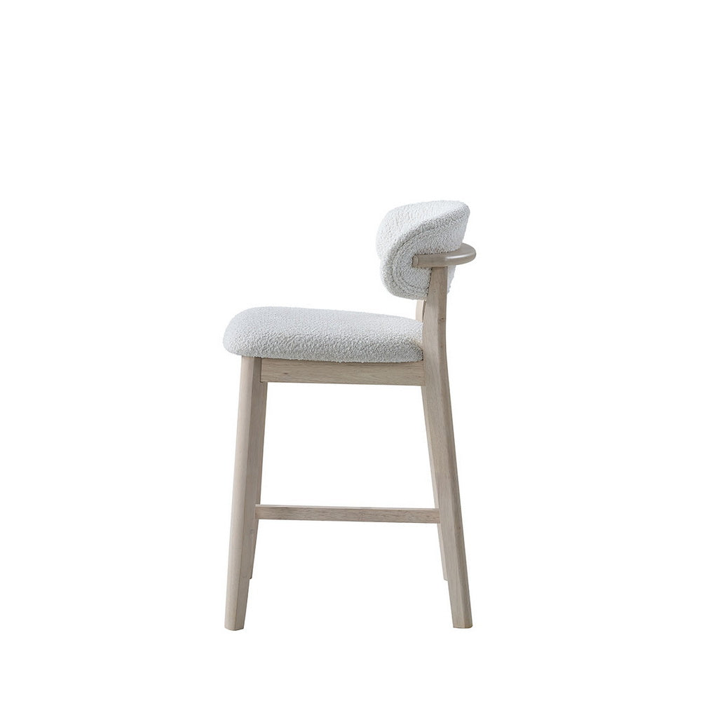 Bar stool with cream upholstered seat and back, light wood legs