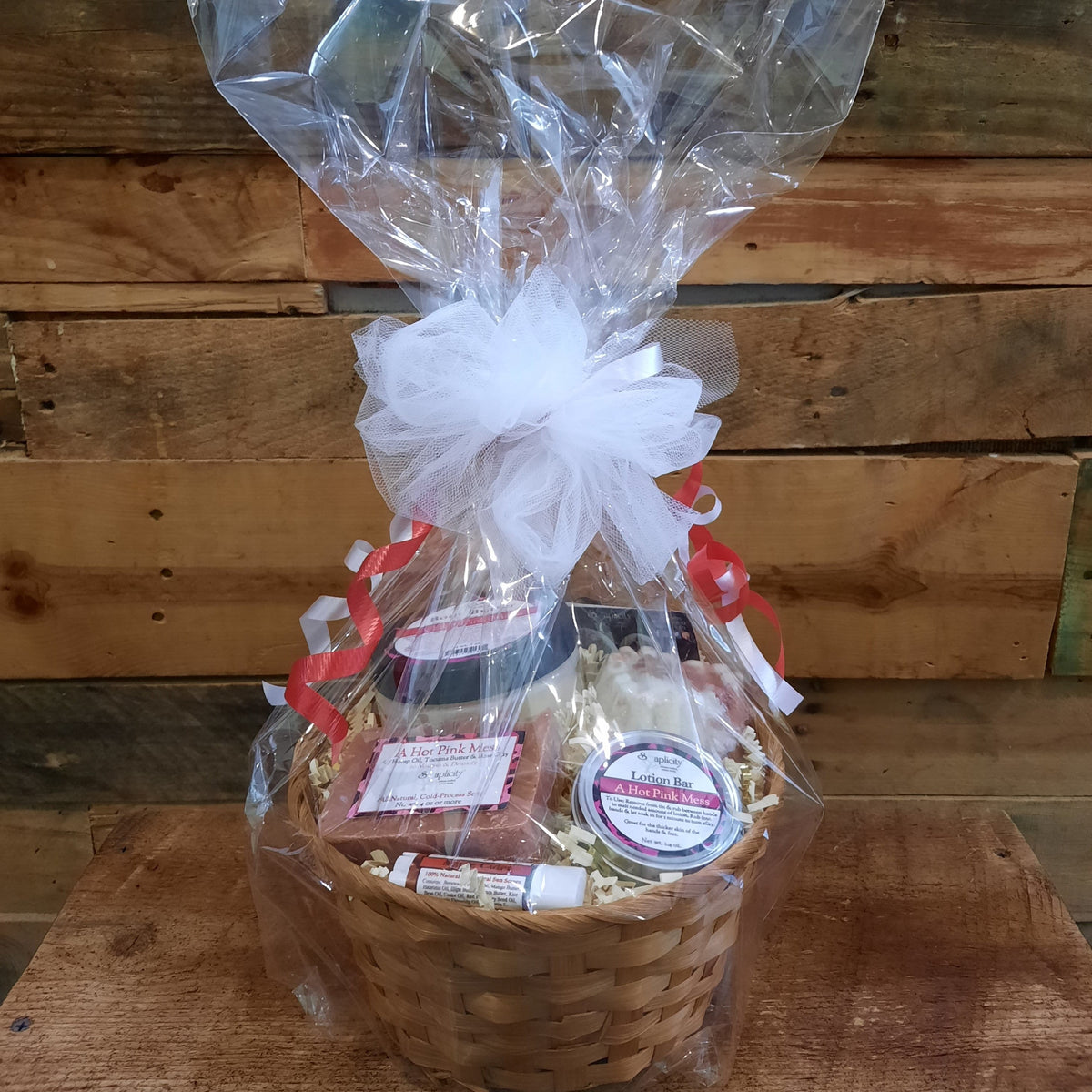 Medium Scentastic gift set basket wrapped in clear plastic with body butter, lotion bar, soap