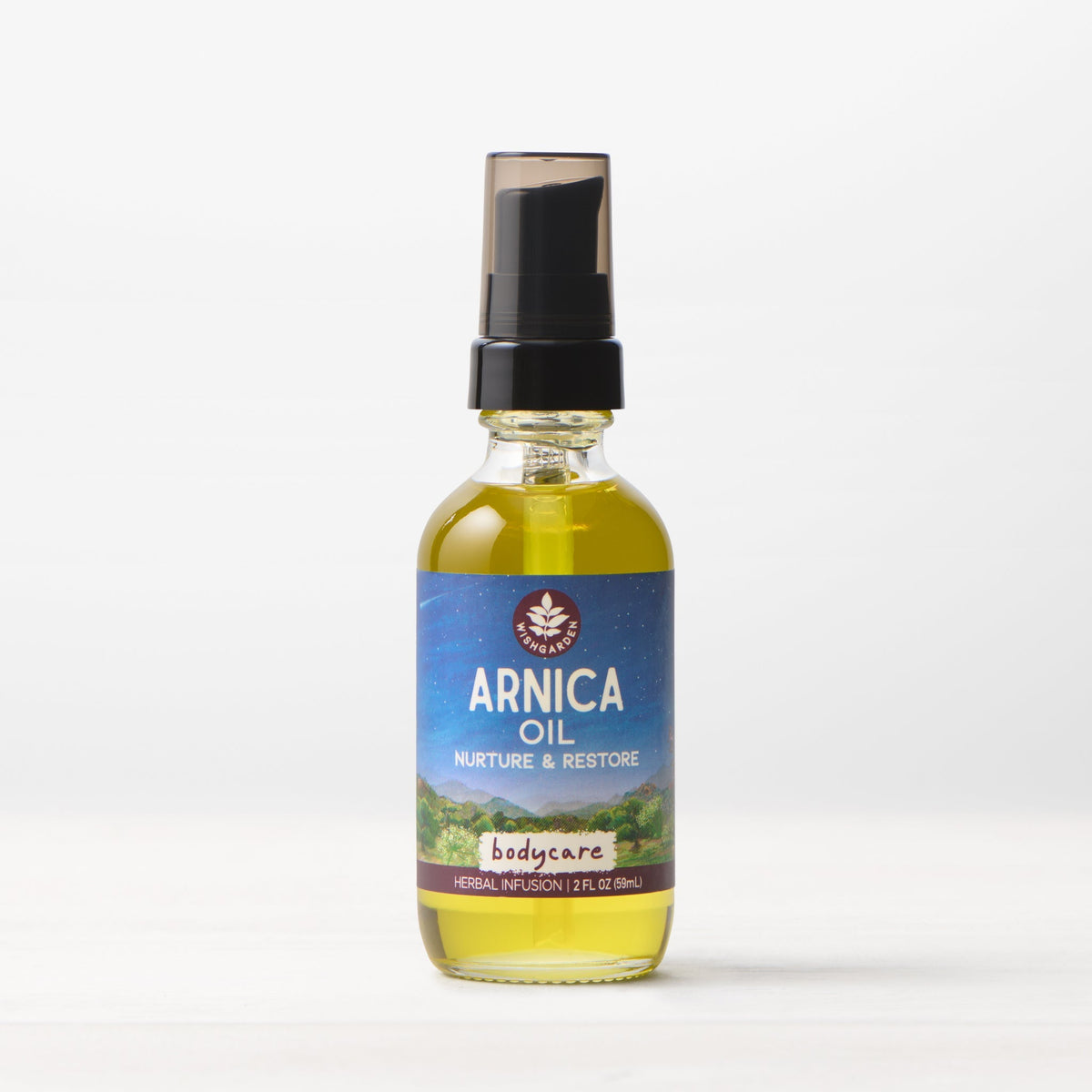 Arnica oil bottle with amber liquid, black pump top, and blue label