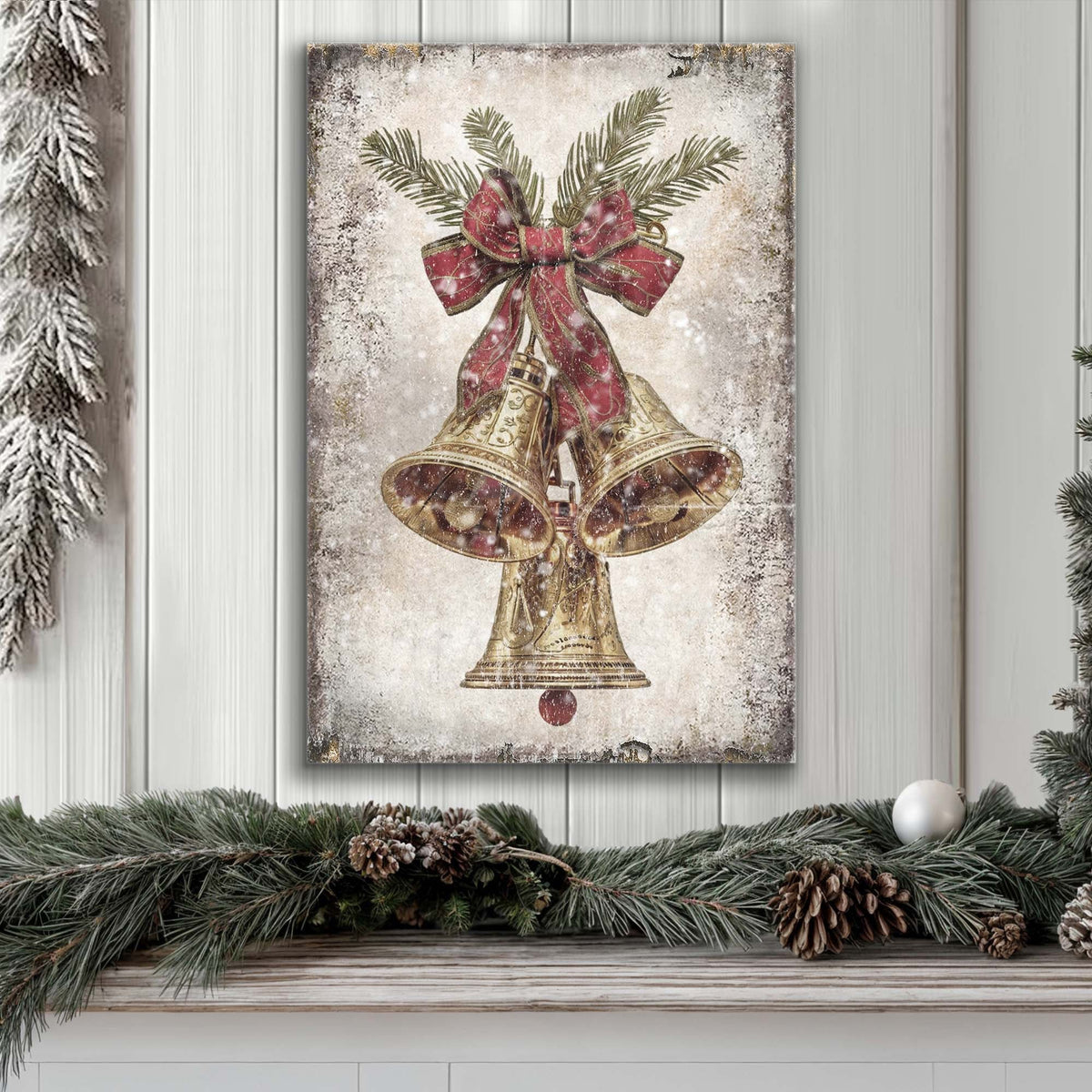 Framed canvas wall art showing gold bells with red bow and pine branch details