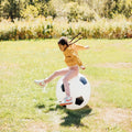 White soccer ball with black pentagon panels for outdoor bounce play