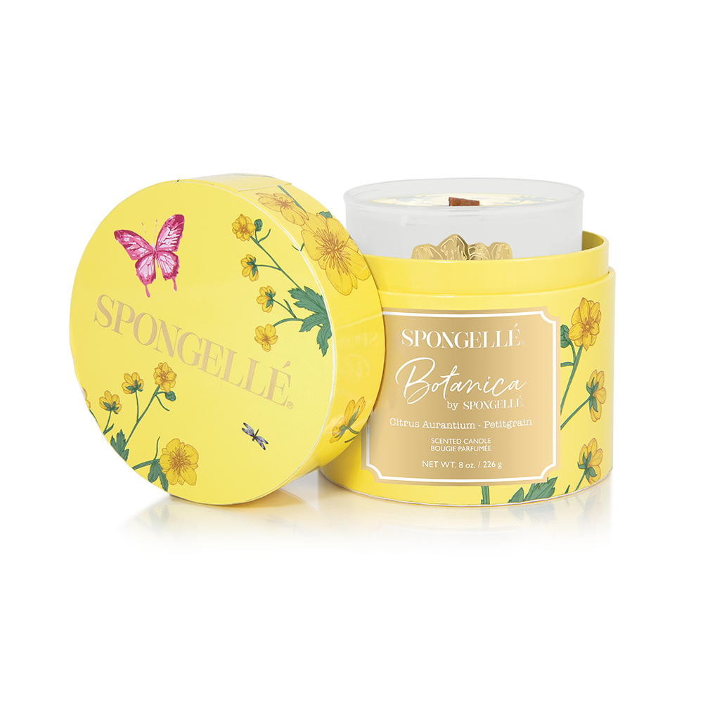 Yellow Botanica candle jar with matching lid featuring botanical flowers and butterfly