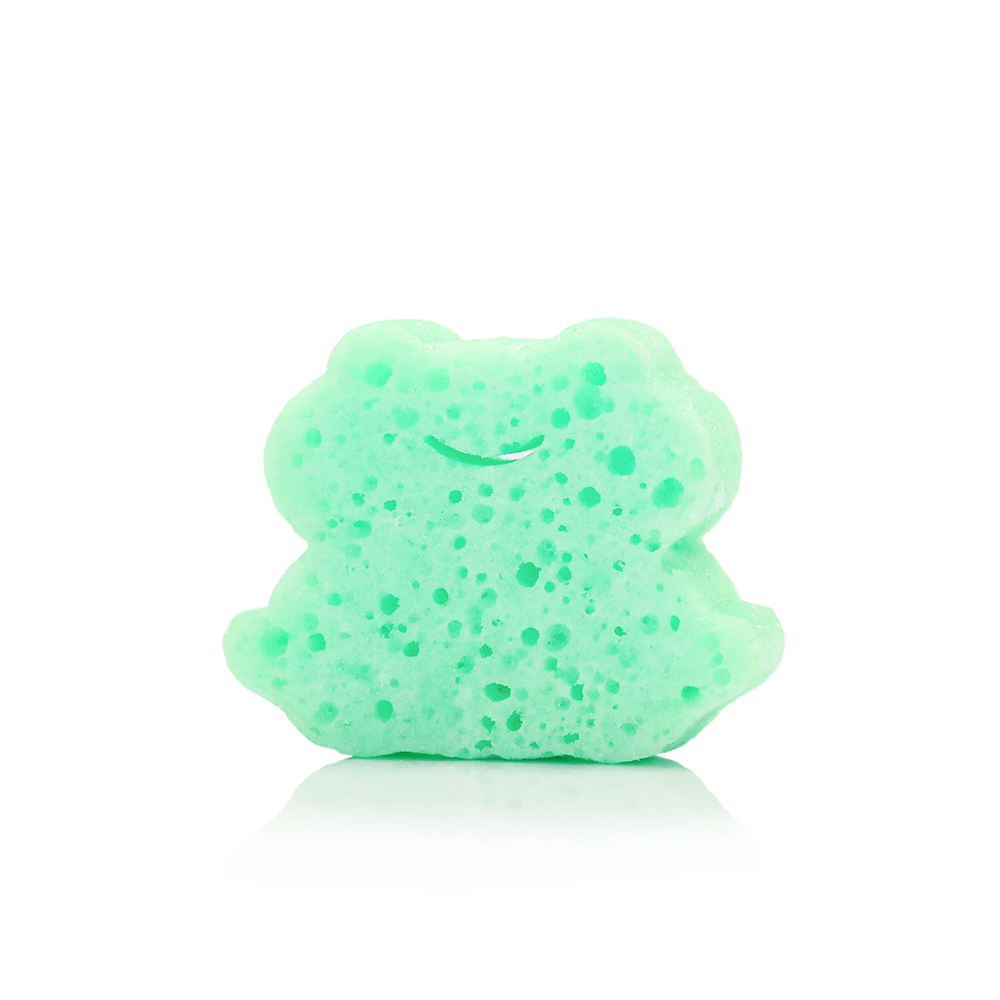 Mint green frog-shaped bath sponge with speckled texture and smiling face