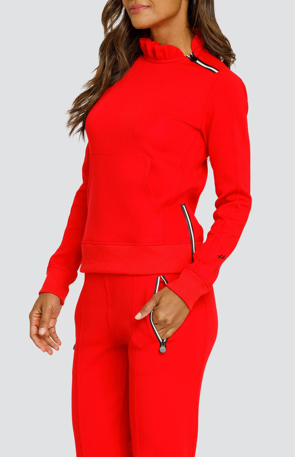 Red pullover with mock neck, front side zipper pulls, and fitted cuffs