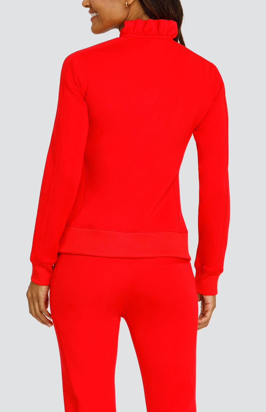 Red mock-neck pullover with long sleeves and seam detailing, side zip accents
