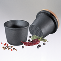 Cast iron spice grater with beech wood lid and small black bowl for spice grinding