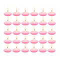 Mini floating candles set with lit flames, pink oval wax cups