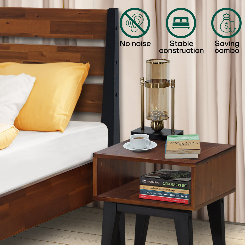Wood bed frame corner with matching nightstand and two-tier open shelving