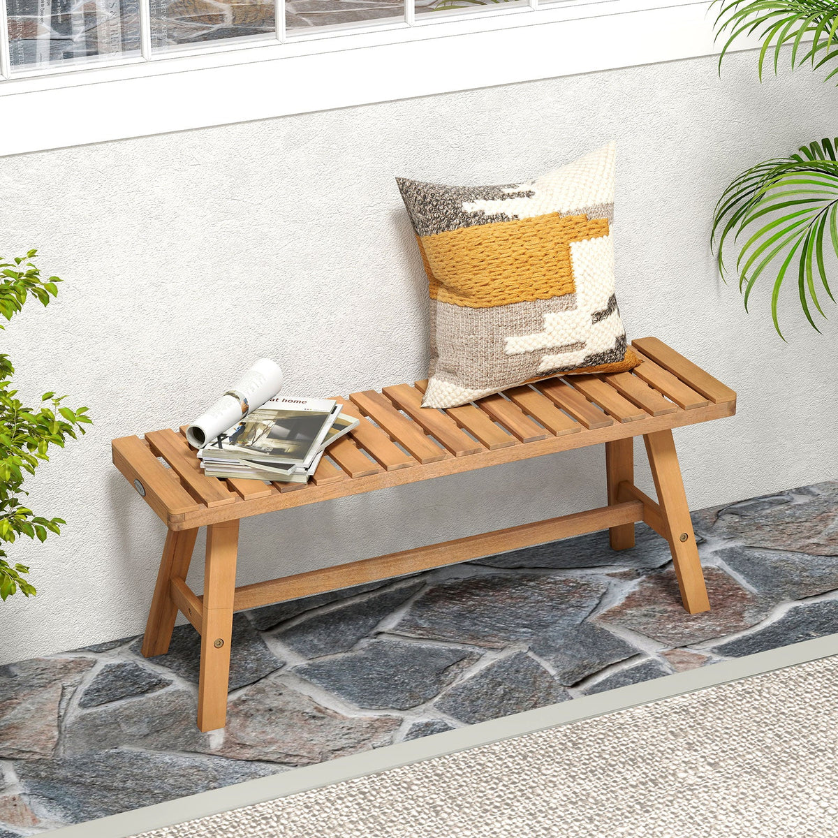 Acacia wood outdoor bench with slatted seat and backrest, side view with armrests