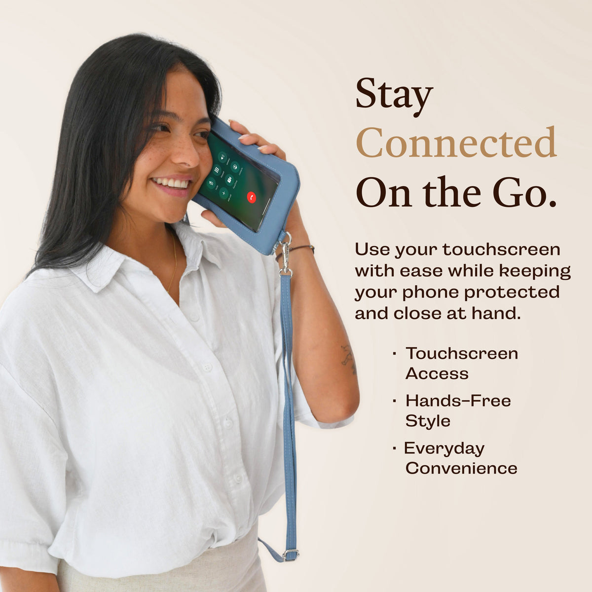 Blue crossbody phone clutch showing touch-screen window and zip closure