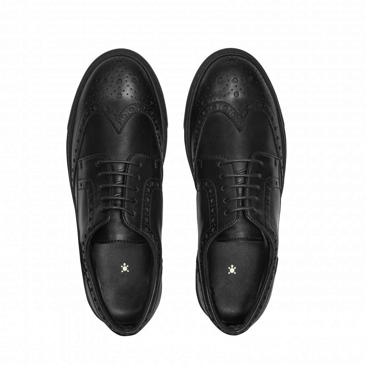 Pair of black lace-up oxfords with perforated toe panels and round-toe silhouette