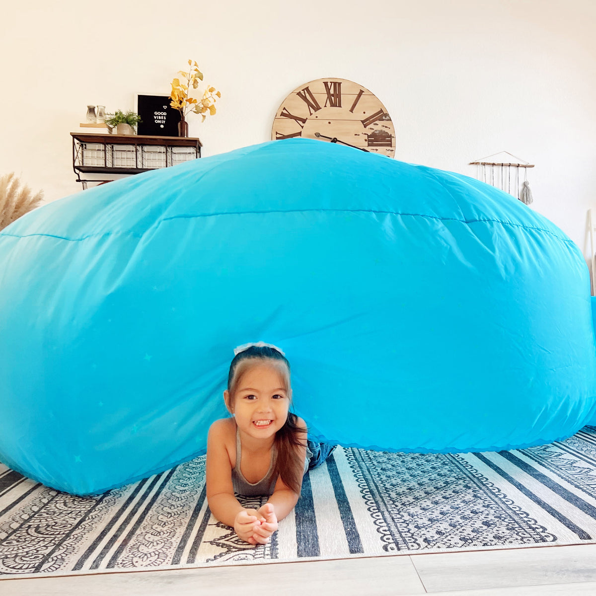 Blue inflatable fort dome with rounded opening and constellation design