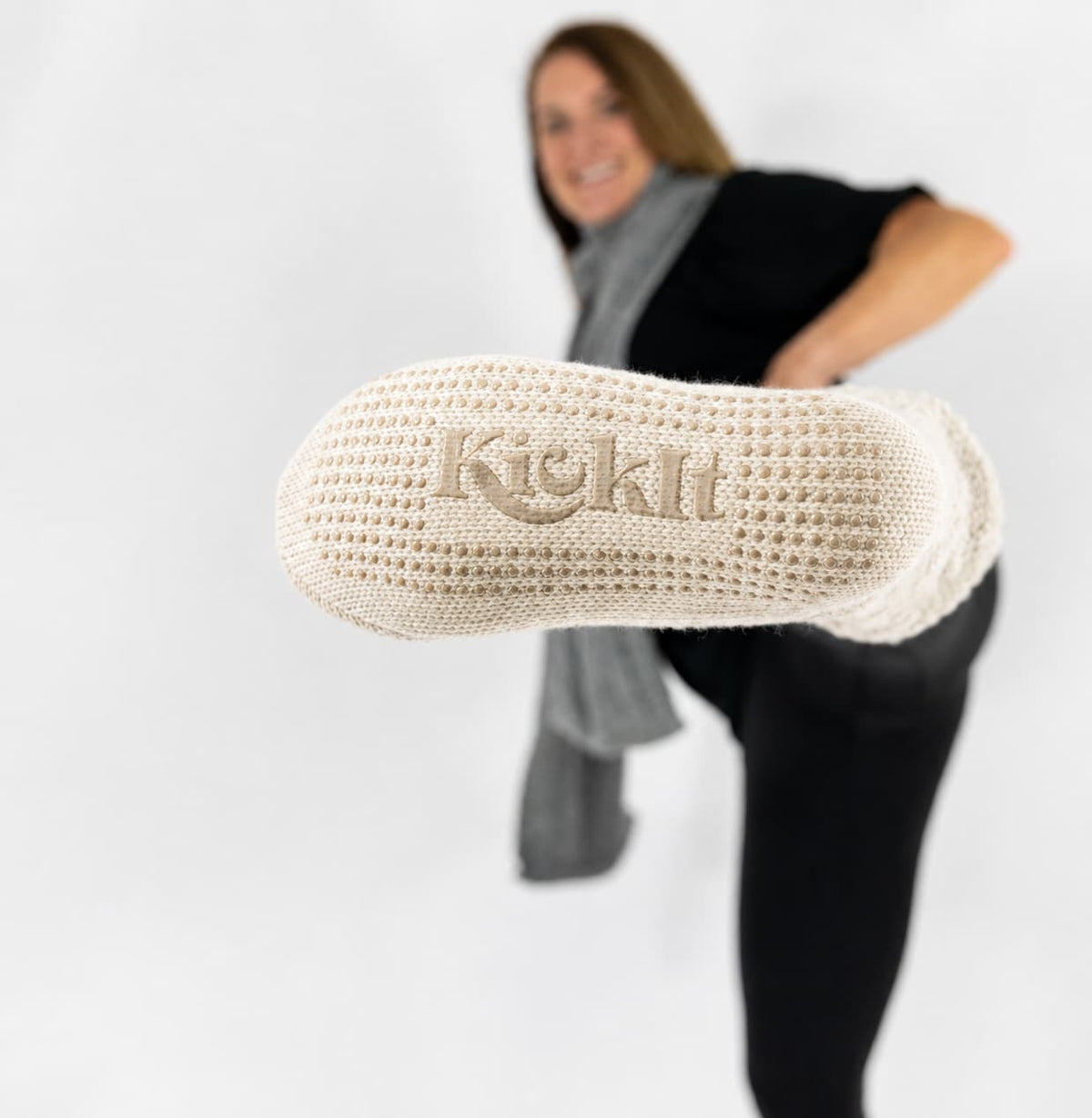 Oatmeal slipper socks with knit logo on cuff and sherpa lining