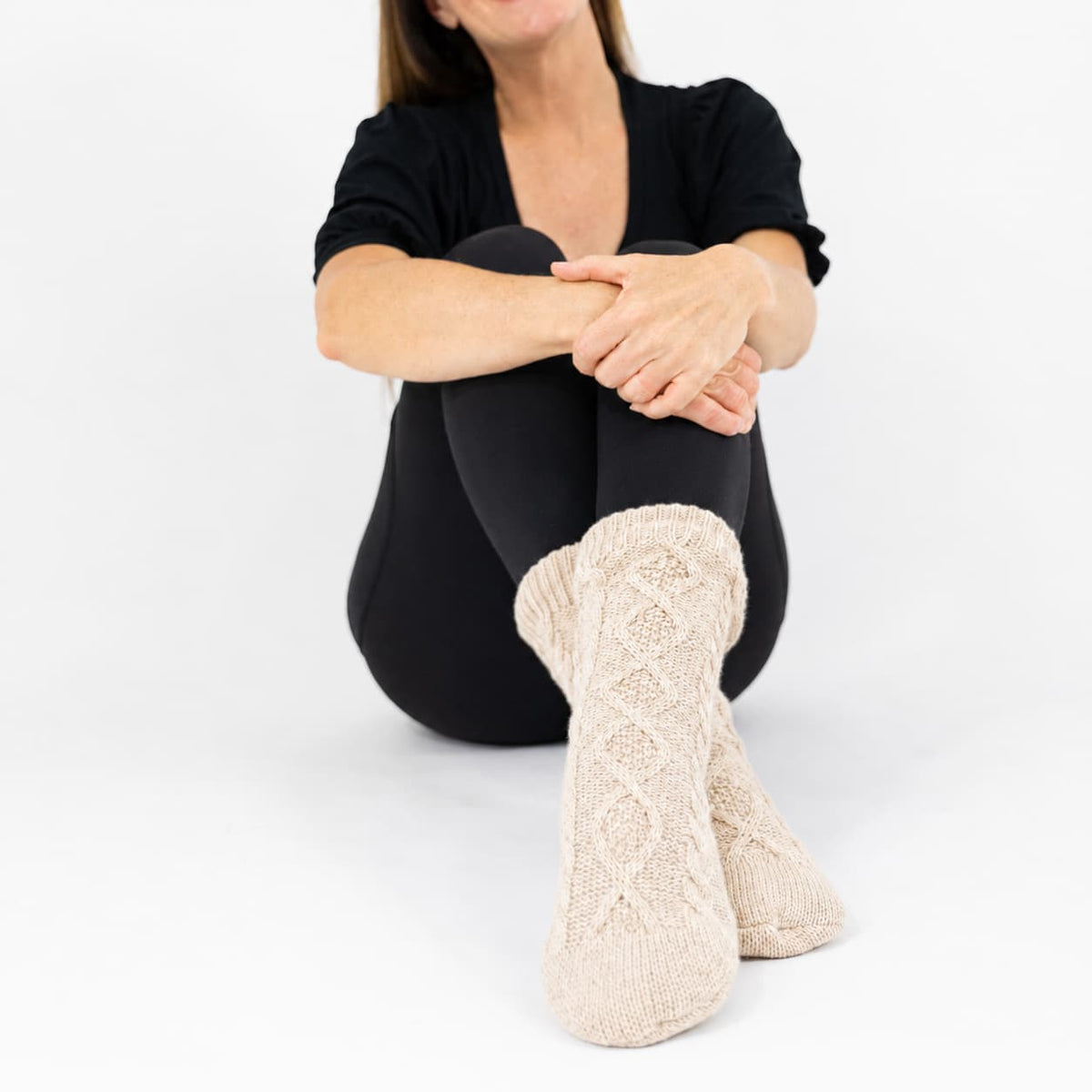 Oatmeal slipper socks with textured knit sole and sherpa cuffs