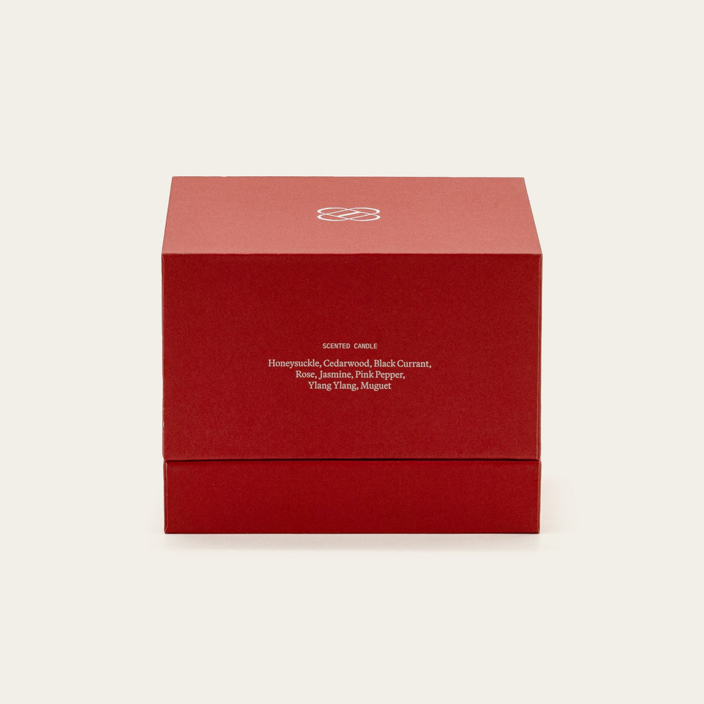 Red candle gift box labeled with candle ingredients