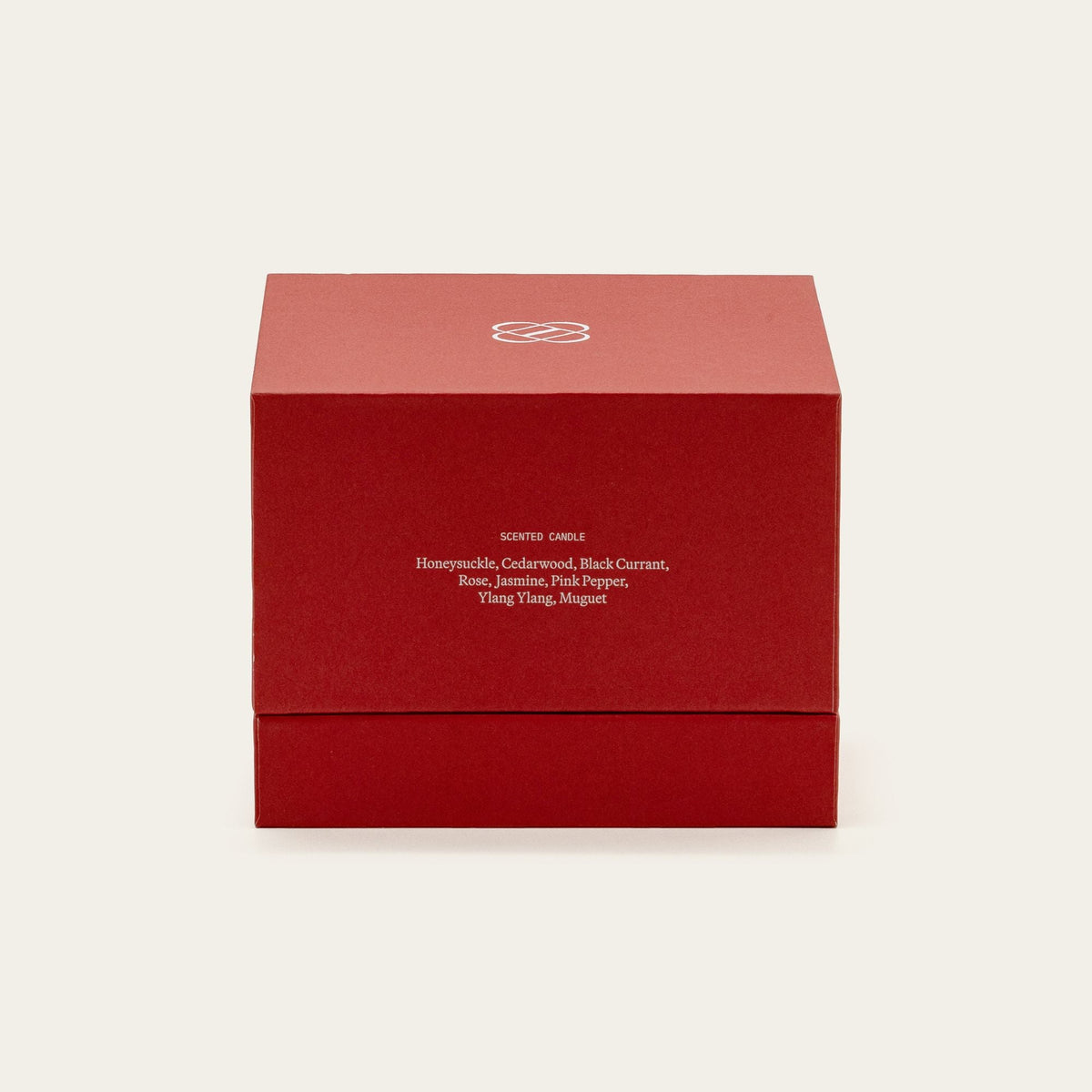 Red candle gift box labeled with candle ingredients