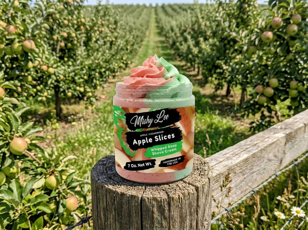 Whipped soap and shave cream jar outdoors on a wood stump with orchard background