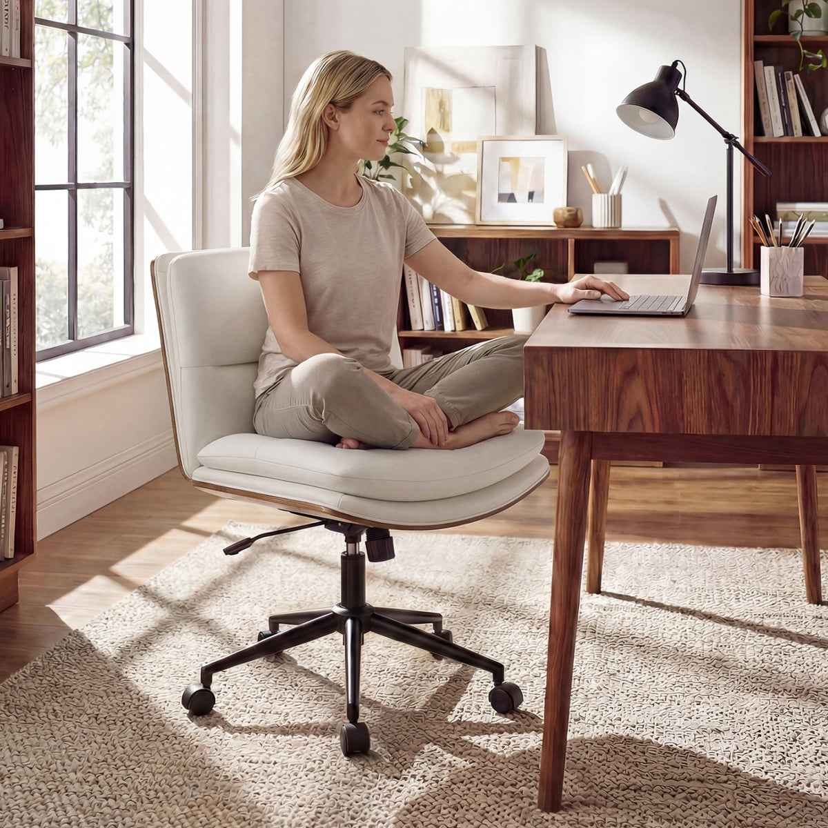 White armless office chair with curved backrest and padded seat, on rolling base.