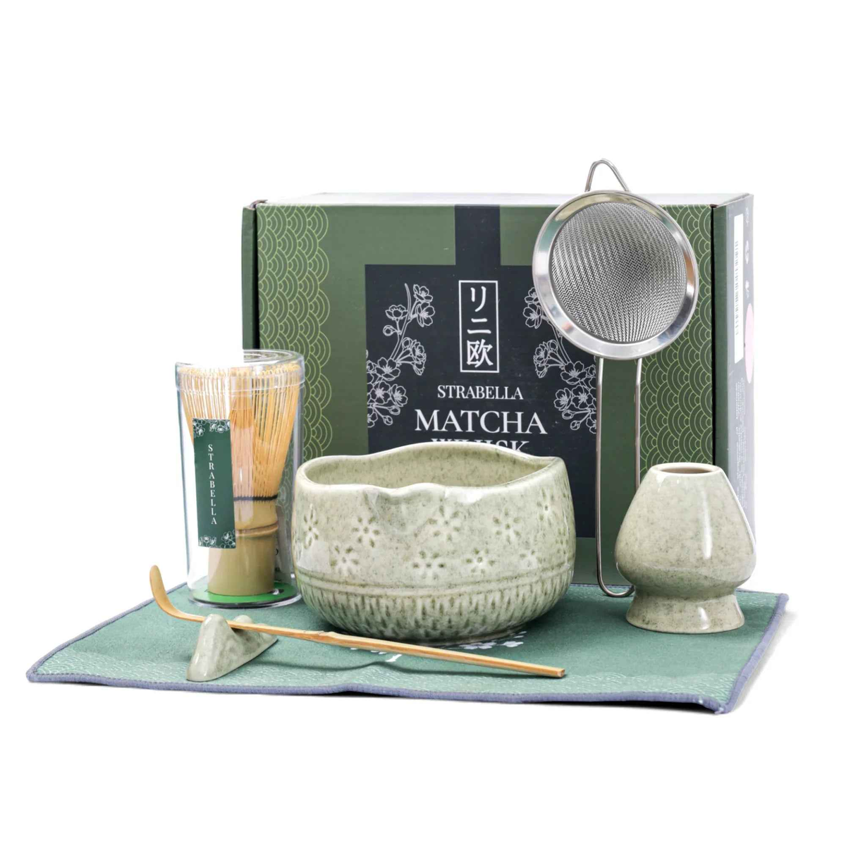 Matcha whisk set with speckled ceramic chawan, whisk, small cup, and mat