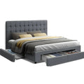 Grey king upholstered bed frame with tufted headboard and two fabric storage drawers