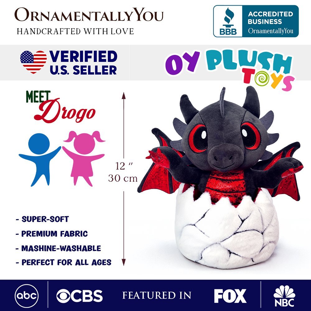 Plush black dinosaur in white egg with red wings and large red eyes, 12 in