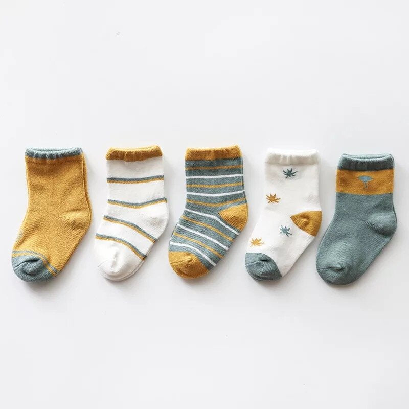 Kids 5-pack sock assortment: mustard, gray, white stripes, and leaf prints