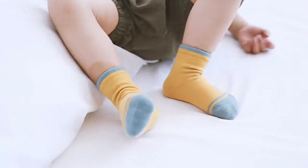 Kids wearing mustard and light blue striped ankle socks