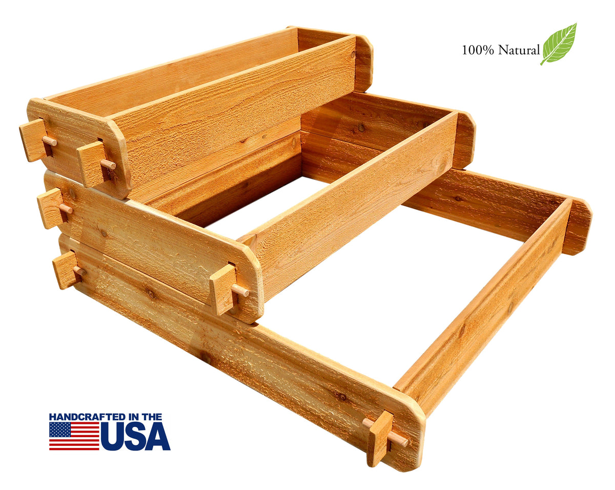 Three-tier cedar raised garden bed planter with open center trough and corner joinery, studio