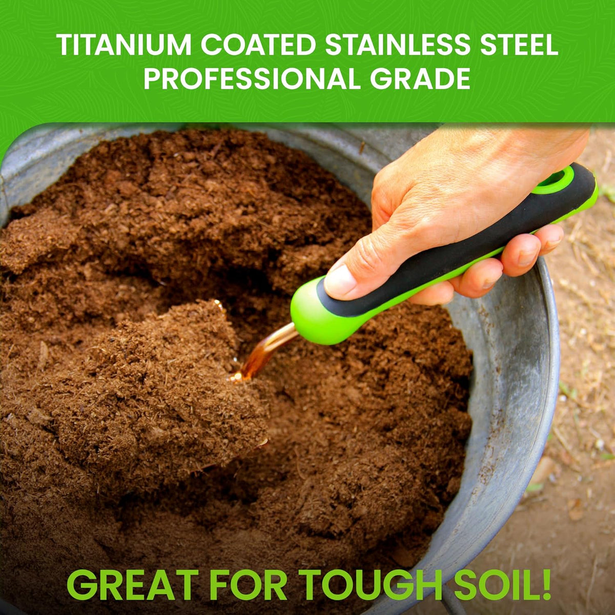 Gold transplanter tool with green handle held in dark soil
